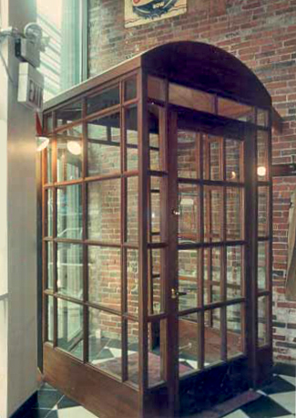 Outside view of Door phone booth in brown color and so many glasses